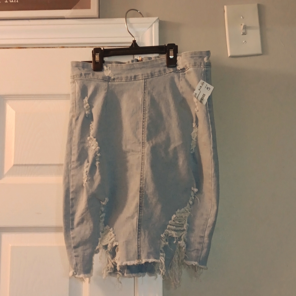 American Bazi size small blue jean distress skirt.